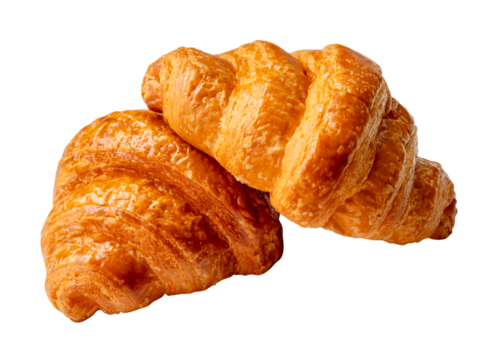 Side view of two brown or golden loaves of croissants in stack or heap isolated with clipping path in png file format