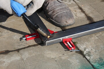 repair work with metal using a welding machine