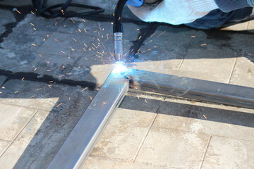 repair work with metal using a welding machine