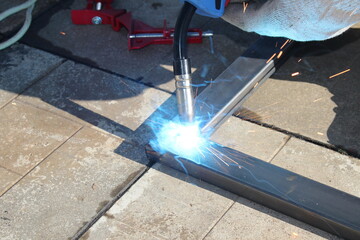 repair work with metal using a welding machine