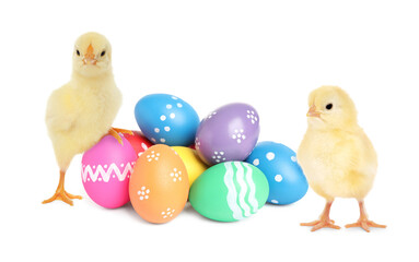 Cute chicks and bright Easter eggs on white background