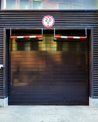 Naklejka premium Garage Entrance with Height Restriction Sign Displayed