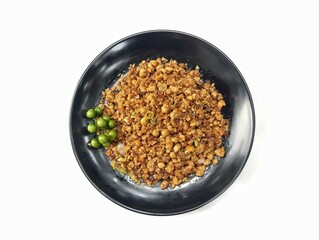 Oseng-oseng oncom or Indonesian food on plate isolated on white background, top view 