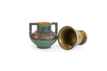 Ceramic vase and brass or copper mug, with textured patina, isolated on white  background, abstract backdrop