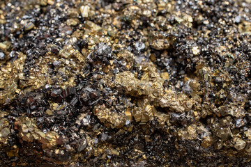 Pyrite mineral flower black and golden color soft focus close up, abstract pattern structure