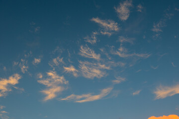 Thin clouds on the blue sky.