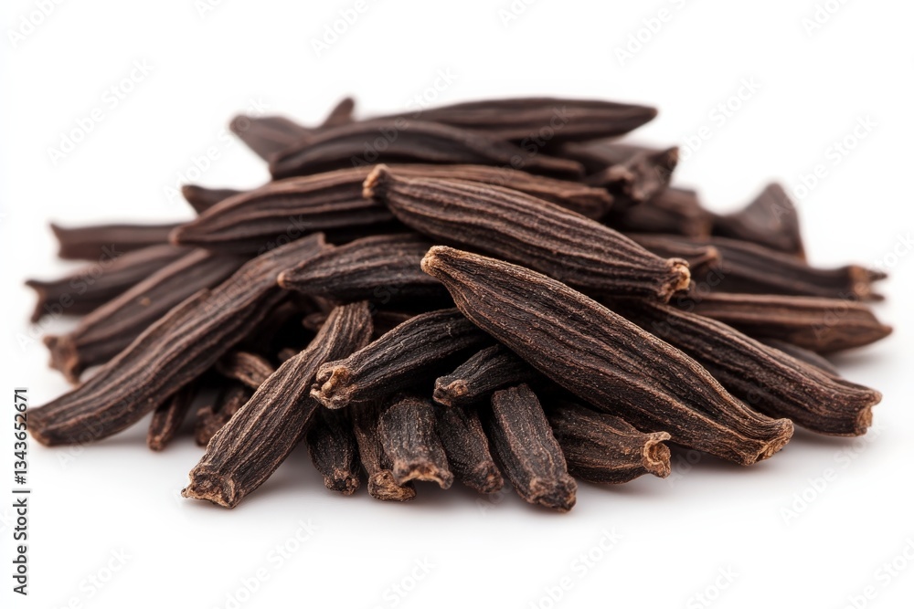 Poster black cardamom pods gathered in a heap, showcasing their unique shape and texture in a bright arrang