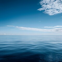 Fototapeta premium Photo of Calm Ocean Water under a Blue Sky