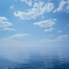 Obraz premium Photo of Calm Ocean Water under a Blue Sky