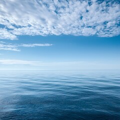Obraz premium Photo of Calm Ocean Water under a Blue Sky