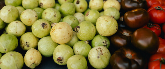 Fresh vegetables at small local urban market. Organic produce on sale at outdoor farmer market. Selling fresh crops and veggies harvest. European urban setting. Close up. Part of the series
