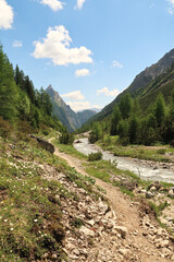 Picturesque view while walking on the trail along the Höhenbach river, stream, creek, E5 Trail, Alps, Holzgau, Austria