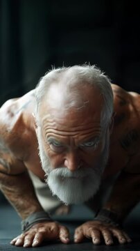 Elderly man performs intense push-ups showcasing strength and determination. Ideal for Social Media, Stories, Advertising