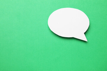 Blank speech bubble on green background. Space for text