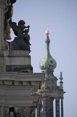 Fototapeta premium Ornate architecture with cherub and church tower.