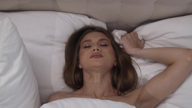 sexual pleasure of a woman in bed