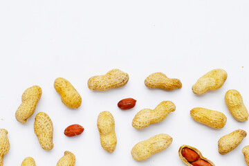 Roasted peanuts in shell on white background.