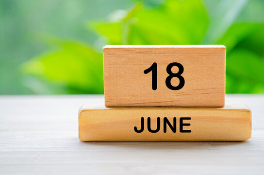 18 June wooden calendar with customizable space for text or ideas. June month concept.