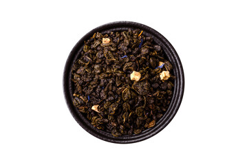 Dry green tea with soursop piece, knapweed petals in bowl