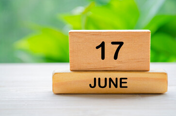 17 June wooden calendar with customizable space for text or ideas. June month concept.