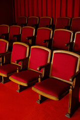 Fototapeta premium Vintage Theater Seats with Red Upholstery