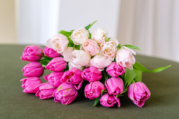 Beautiful Pink and White Tulips on Green Velvet Table