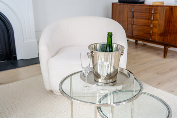 Luxurious sparkling wine  Bottle with Ice Bucket on Glass Table