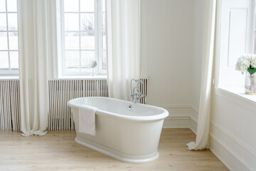 Bright and Elegant White Bathroom with Large Window