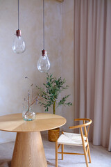 Rustic Willow Branches in Glass Vase on Wooden Table