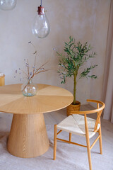 Minimalist Dining Area with Wooden Furniture and Glass Vase
