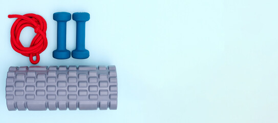 Vibrant blue background sets the stage for a layout featuring sports equipment including jump rope,...