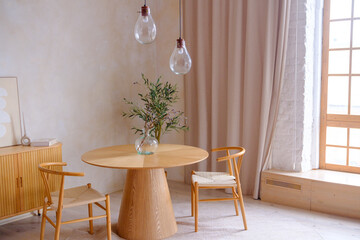 Minimalist Dining Area with Wooden Furniture and Glass Vase