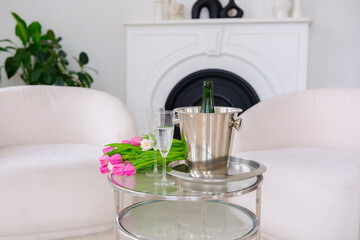 Bouquet of Tulips on a Glass Table with Champagne Glasses