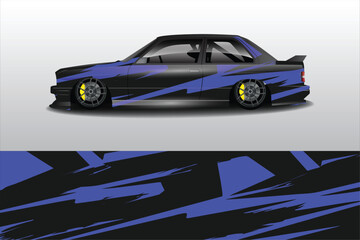 Obraz premium Sleek modified car with blue and black design, showcasing lowered stance and custom wheels