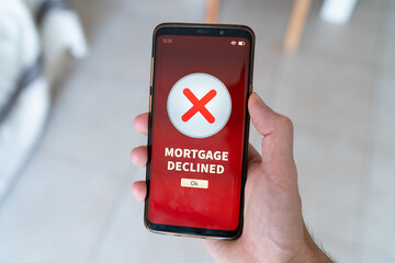Mortgage declined notification on smart phone.