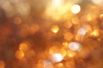 Golden bokeh abstract light background © tomertu