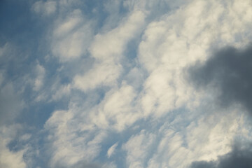 Fototapeta premium The smooth movement of clouds across the sky resembles the slow rhythm of nature's breath. Symbolizes balance and harmony with the surrounding world.