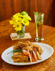 fried chicken dinner with stuffing and steamed vegetables