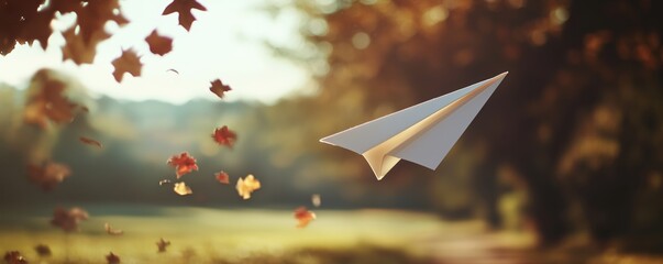 paper plane flies against the background of falling leaves