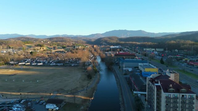 Piegon Forge, TN aerial push in at sunset above the West Prong Little Pigeon River.
