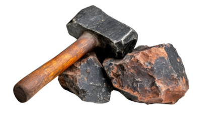 Hammer and Rocks: A heavy-duty hammer rests atop a collection of weathered, textured rocks, creating a stark contrast in materials and implying strength, construction, or deconstruction.