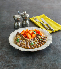 sliced pot roast with carrots and onions