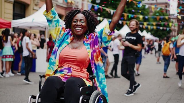 Joyful Black Woman in Wheelchair Celebrating at Vibrant Outdoor Festival with Colorful Confetti and Lively Crowd in Background