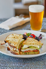 turkey sandwich with a pint of beer