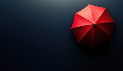 Vivid red umbrella against a sleek dark background.