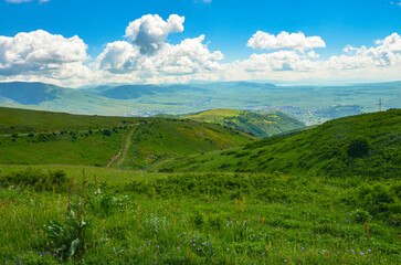 Naklejka premium Hrazdan valley, Sevan Lake and Arjanots Mountain Range scenic view from Teghenis mountain slopes (Kotayk province, Armenia) 