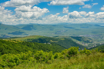 green forests and Tsaghkadzor ropeway on the slopes of Teghenis mountain (Kotayk province, Armenia)