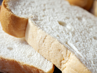 Close-up of freshly sliced ​​soft and fragrant bread with white bread,brown bread crust macro