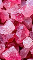   A mound of pink crystals atop another mound of pink crystals, which rests atop yet another pile of pink crystals