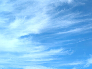 Wispy high-altitude delicate feathery white clouds in the sky